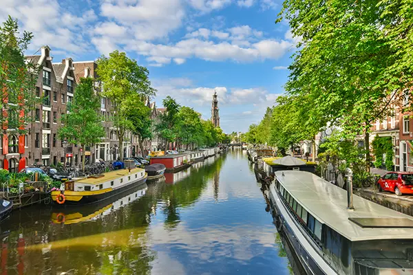 Canal city Amsterdam with boats